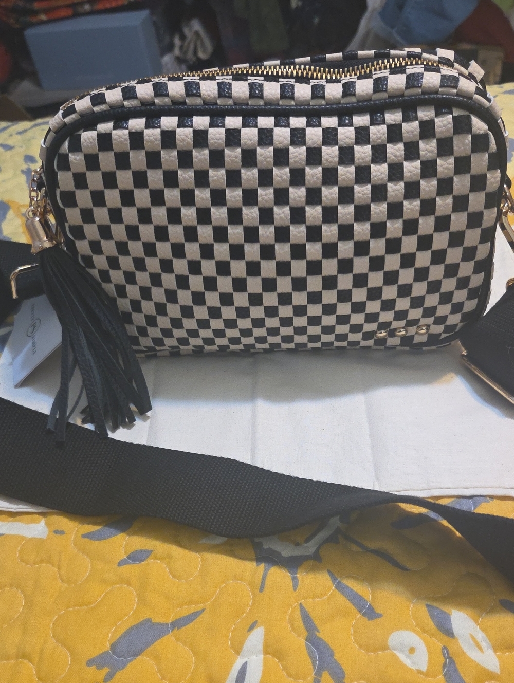 Checkered Black and White Crossbody Bag with Tassel Accent